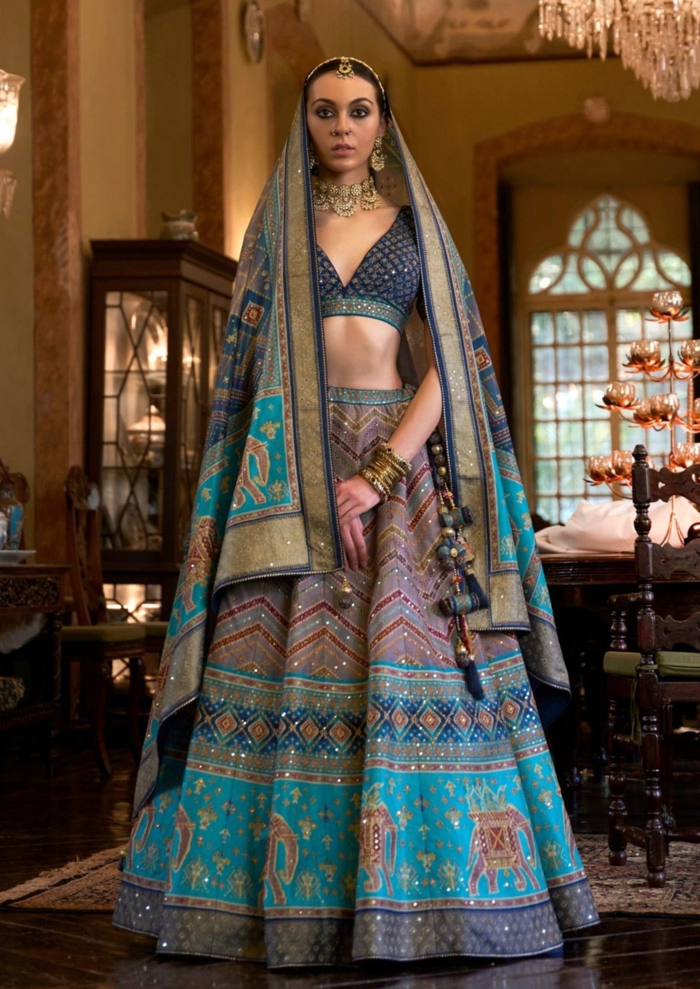 bride in designer silk bridal lehenga in blue colour