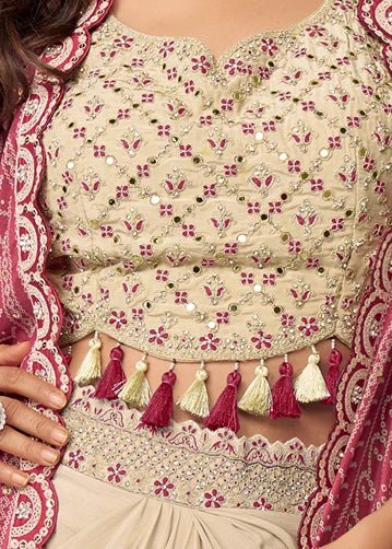 Close-up of zari embroidery and mirror work and tassel trim on premium beige chinon silk blouse paired with bandhani shrug jacket for festive fusion wear in USA.