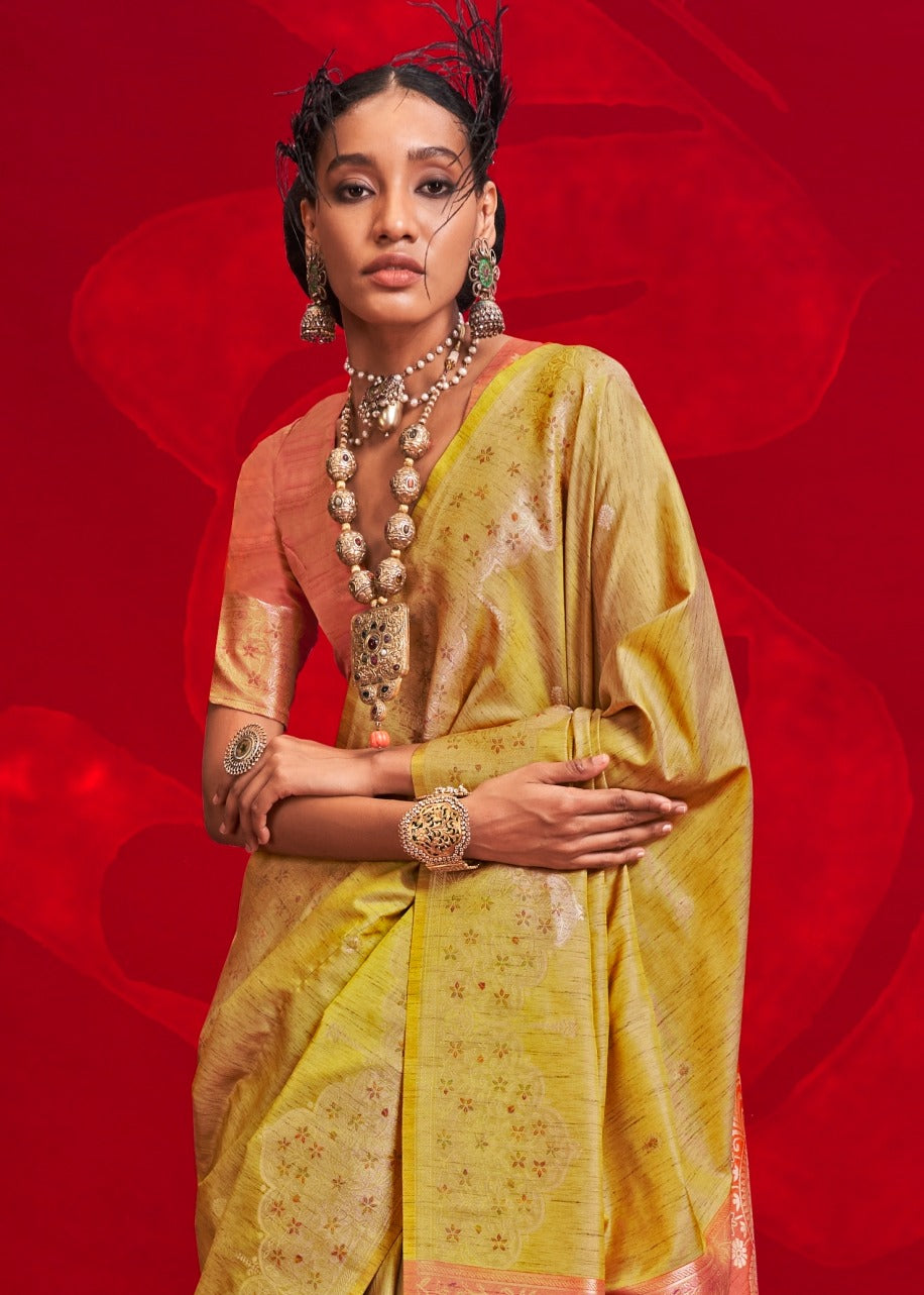 Exquisite yellow tussar silk saree with orange blouse – handloom crafted for special occasions, weddings & cultural celebrations.