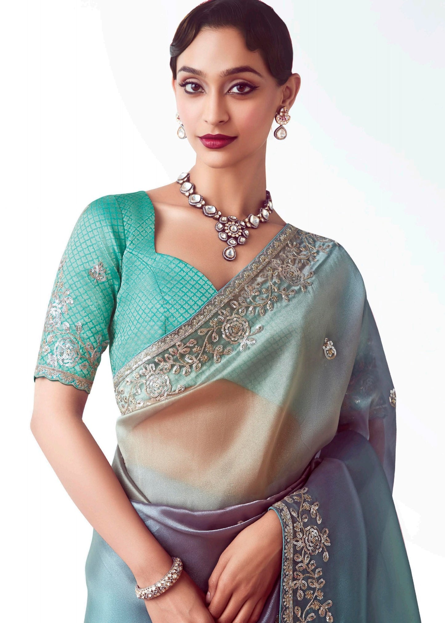 Bridal organza tissue silk saree in blue color with zari work and embroidery for festive wear paired with blue banarasi silk brocade blouse.