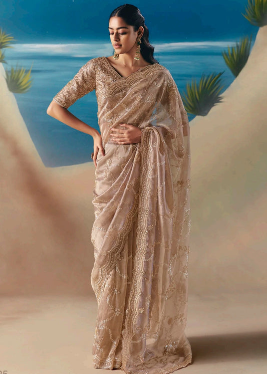 Beige organza tissue silk hand embroidered bridal saree with beadwork and sequins embroidery for glamorous wedding look, reception night, diwali parties and haldi.