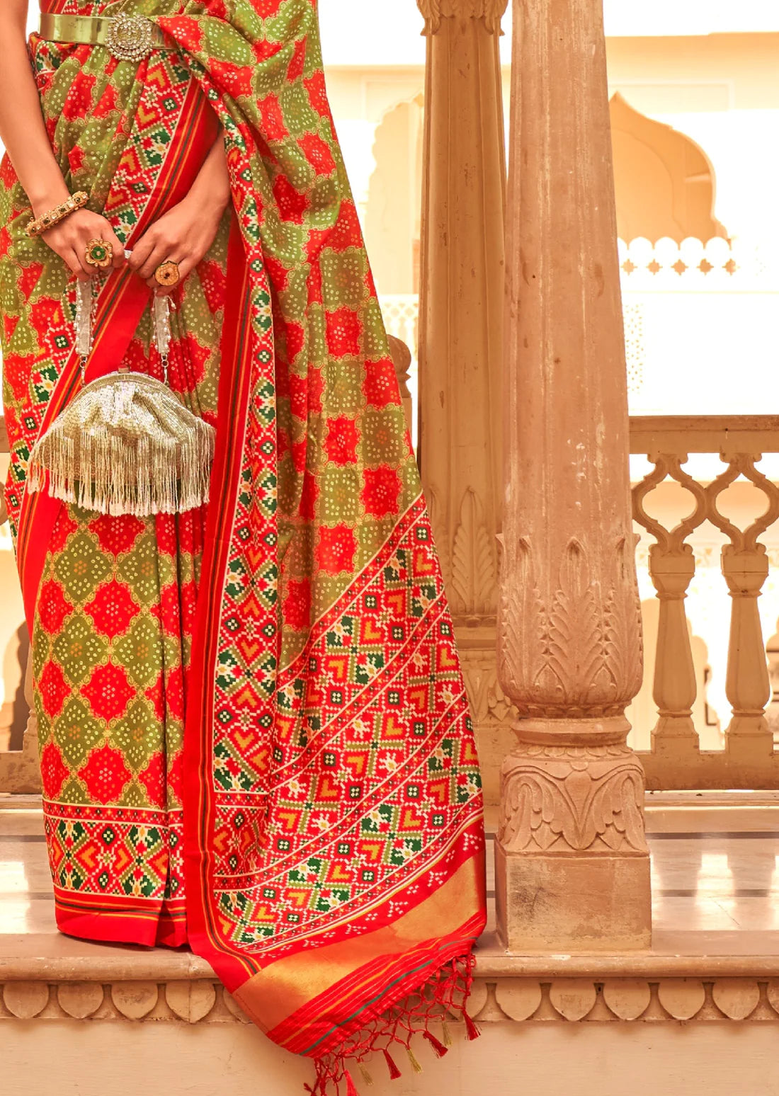 Green and red patola silk saree design.