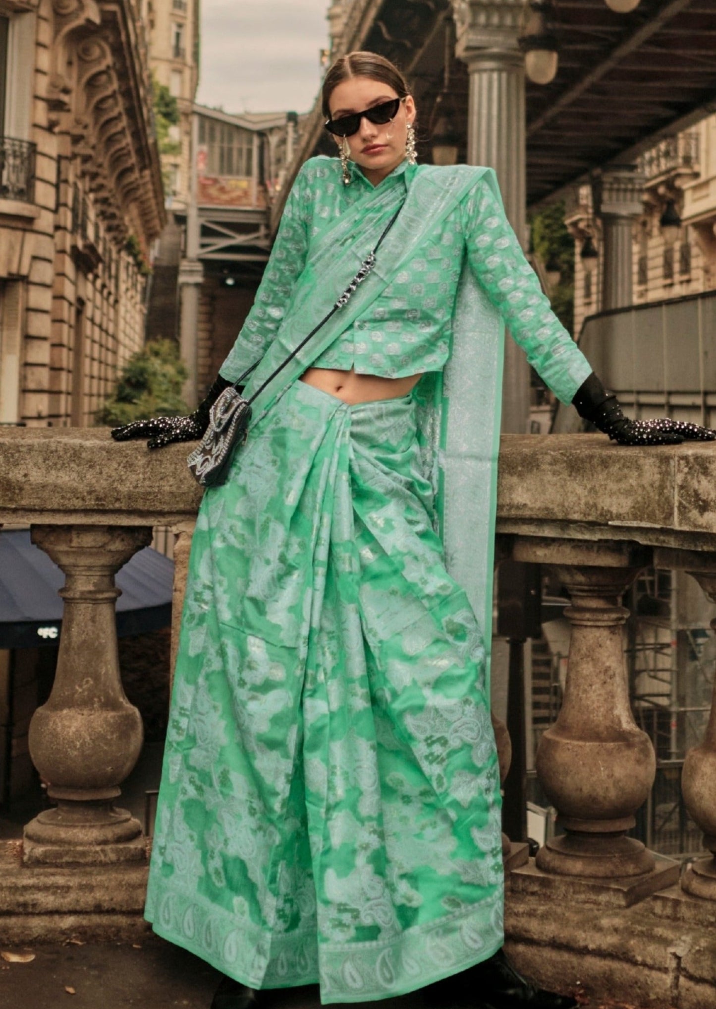 Woman in green organza lucknowi saree blouse.