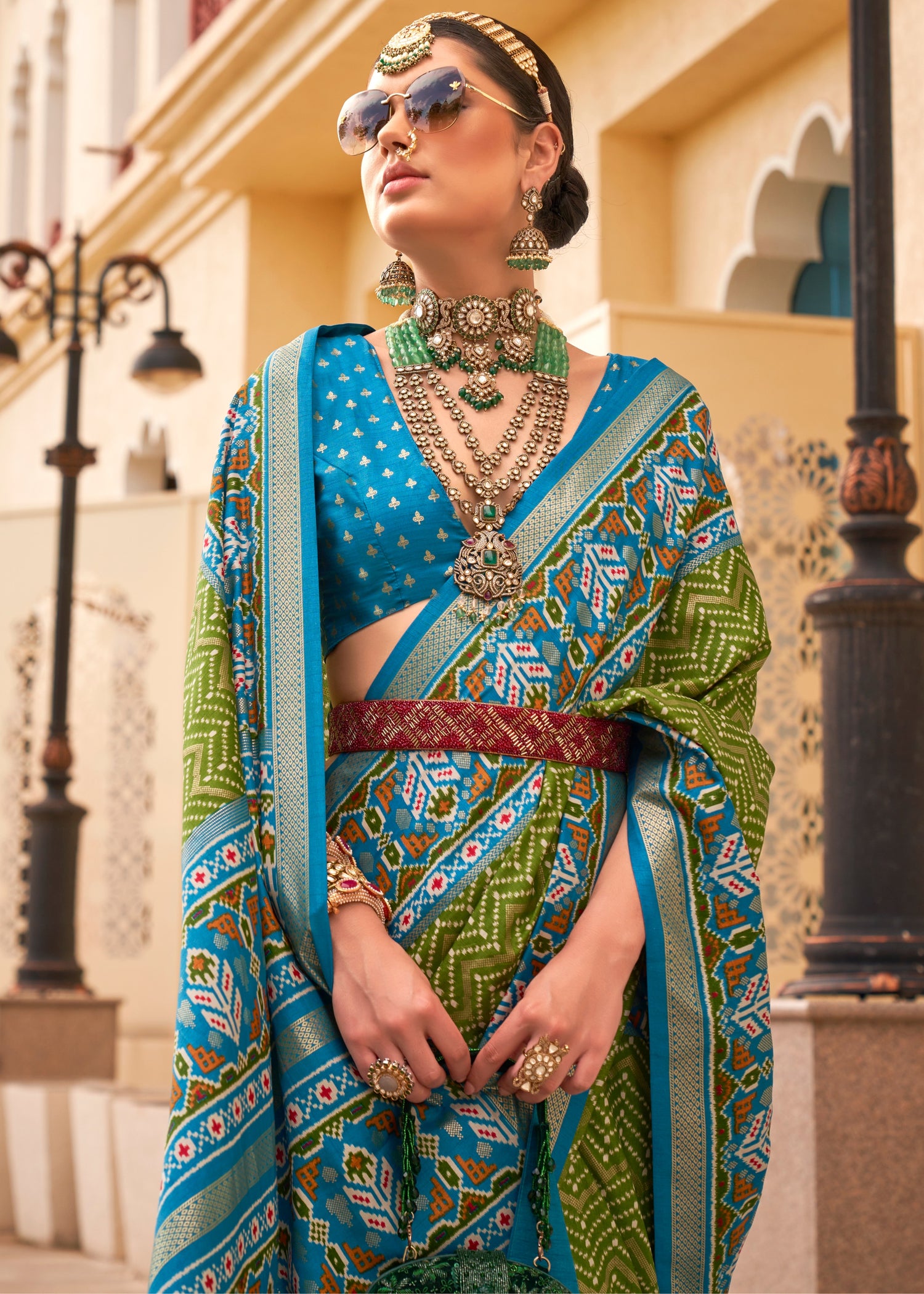 Green patola silk saree with blue blouse online shopping for wedding, festivals and office wear.