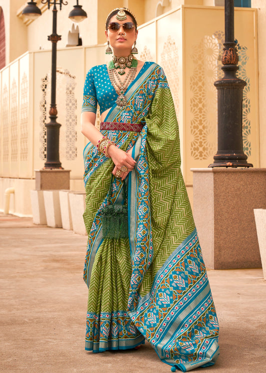 Shop green patola silk saree online with contrast blouse blouse on sale.