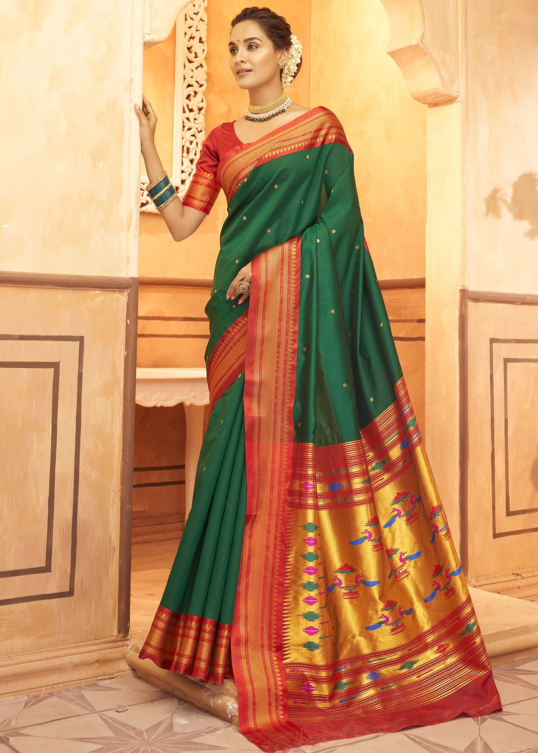 Green and red bridal paithani silk saree online india for wedding look in traditional design.