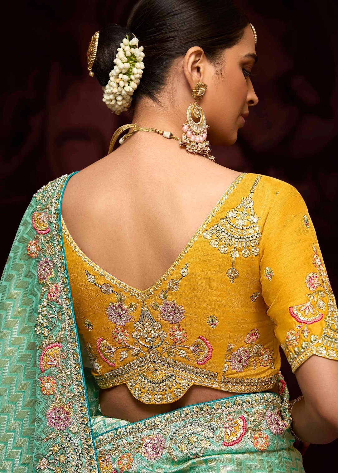 Green banarasi silk bridal saree with yellow handwork embroidery blouse for elegant wedding look.