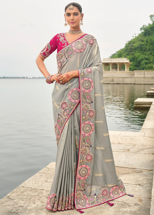 Banarasi viscose tissue silk grey handloom embroidered saree with rani pink blouse and cut work border for weddings.