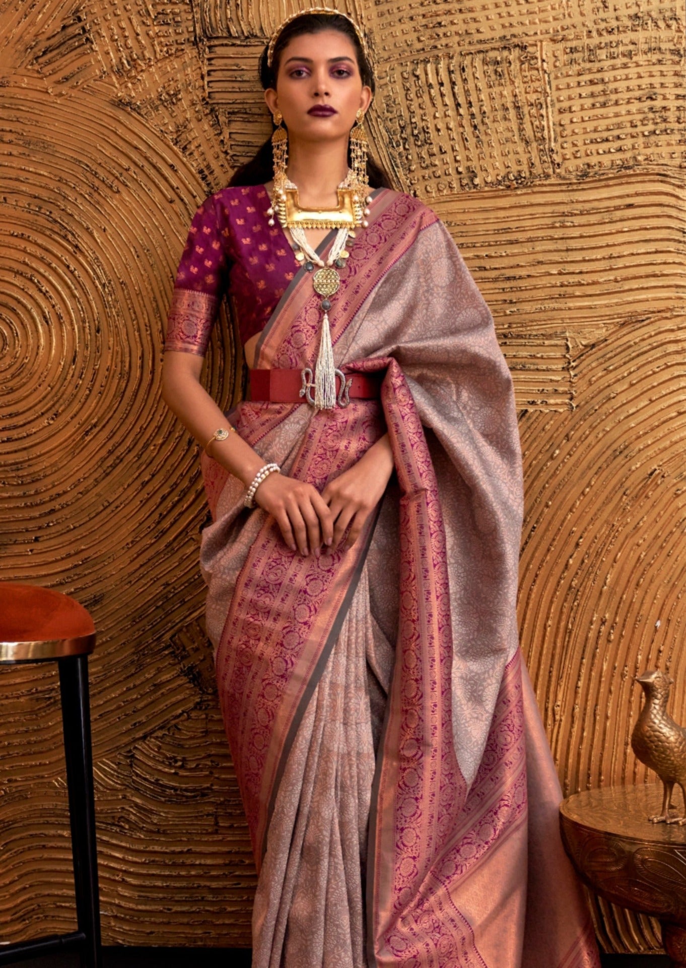 Grey kanjivaram silk saree with contrast maroon blouse.