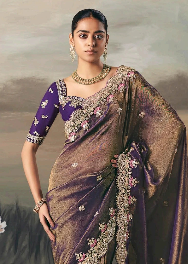 Close-up of hand embroidery and zari work on metallic copper brown tissue silk bridal saree.