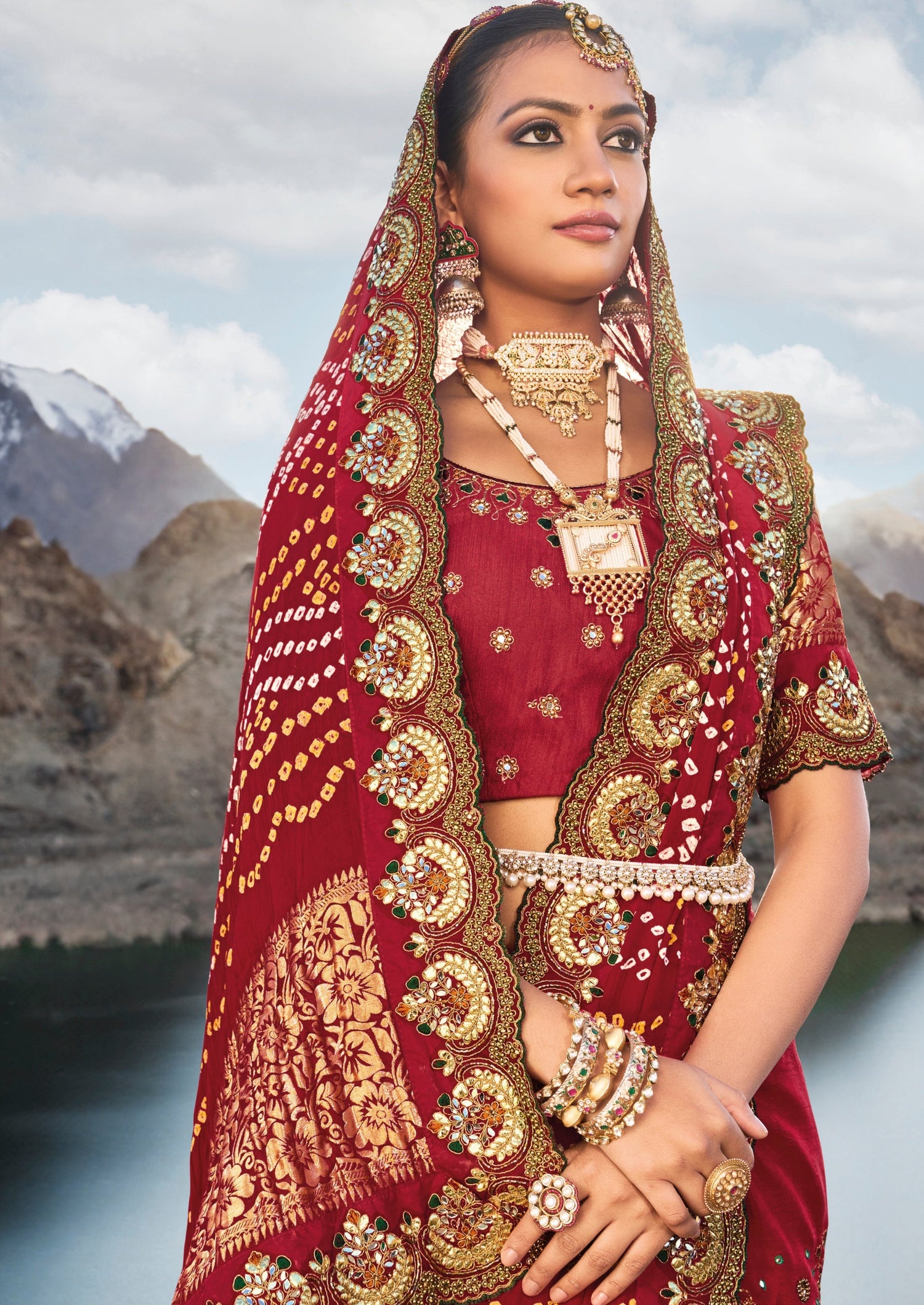 Hand embroidery kutch mirror work banarasi silk red bandhej luxury saree online in red color.