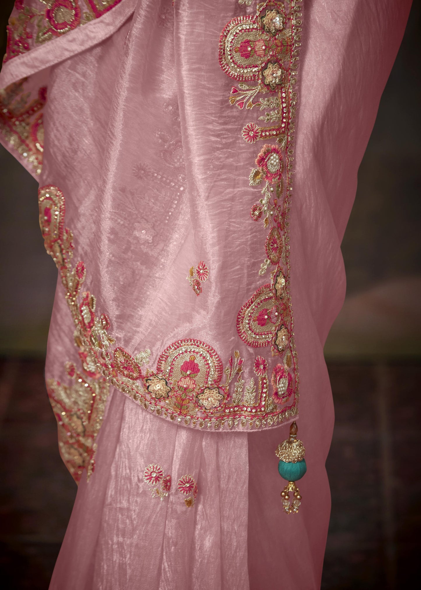 Handcrafted rose pink tissue silk saree with green embroidered blouse, a stylish choice for USA weddings and festive occasion.