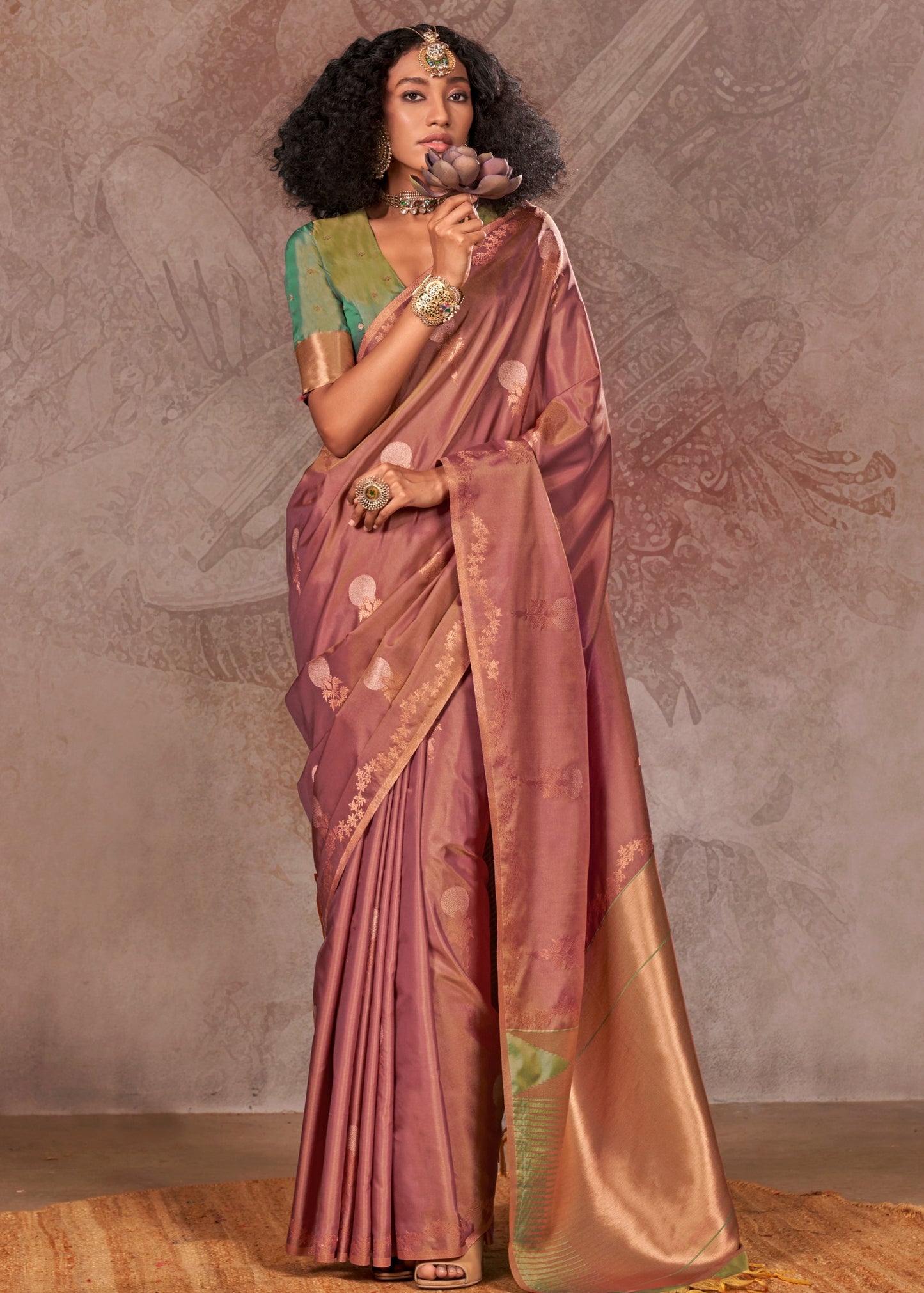 Elegant soft handloom banarasi silk brown saree with intricate gold zari work, paired with a contrasting green blouse for a classic Indian bridesmaids look.