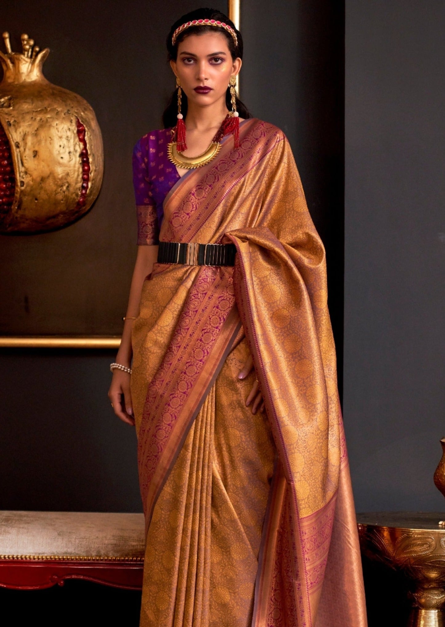 Handloom golden kanjivaram silk saree with contrast blouse.