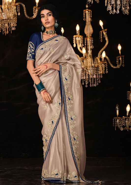 Handwork embroidery fancy saree online india in beige color with contrast blouse silk blouse.