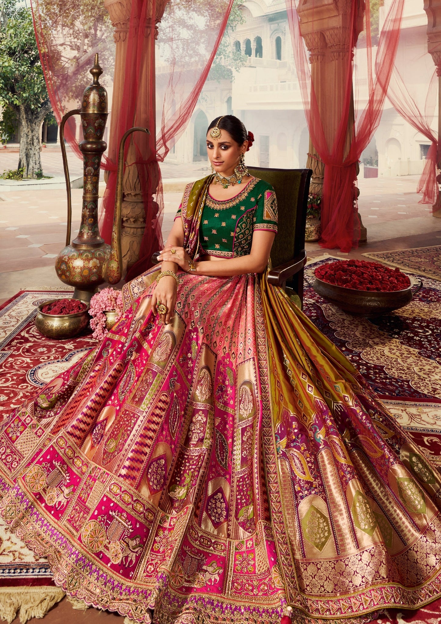 Bride in hot pink banarasi silk lehenga green choli with dupatta.