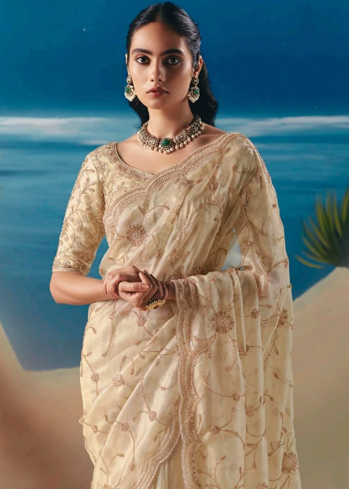 Designer ivory cream organza tissue bridal saree with luminous sequins and beadwork hand embroidery for haldi, bridesmaids look and cocktail party.