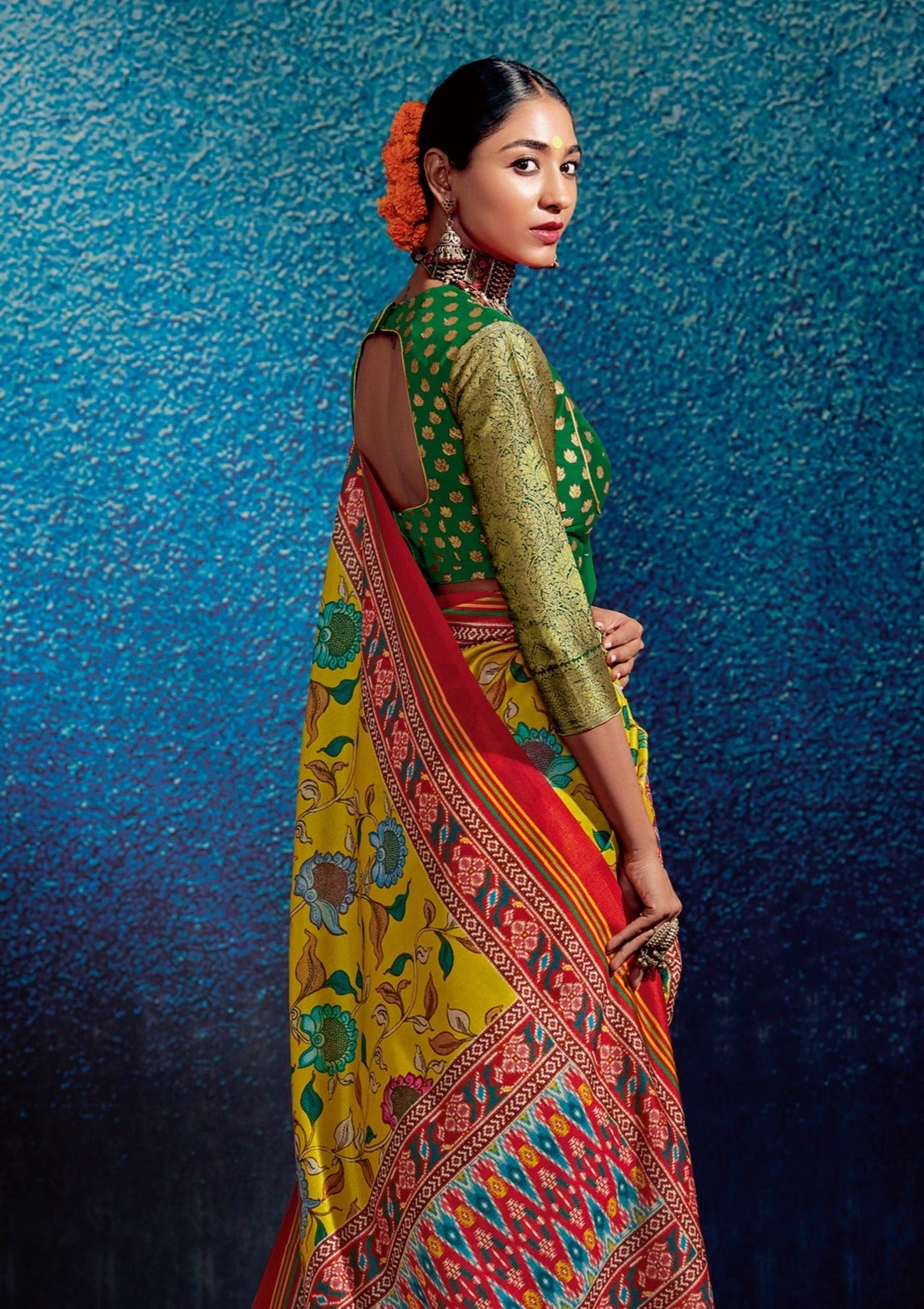 Woman standing in kalamkari-patola-fusion-yellow-saree