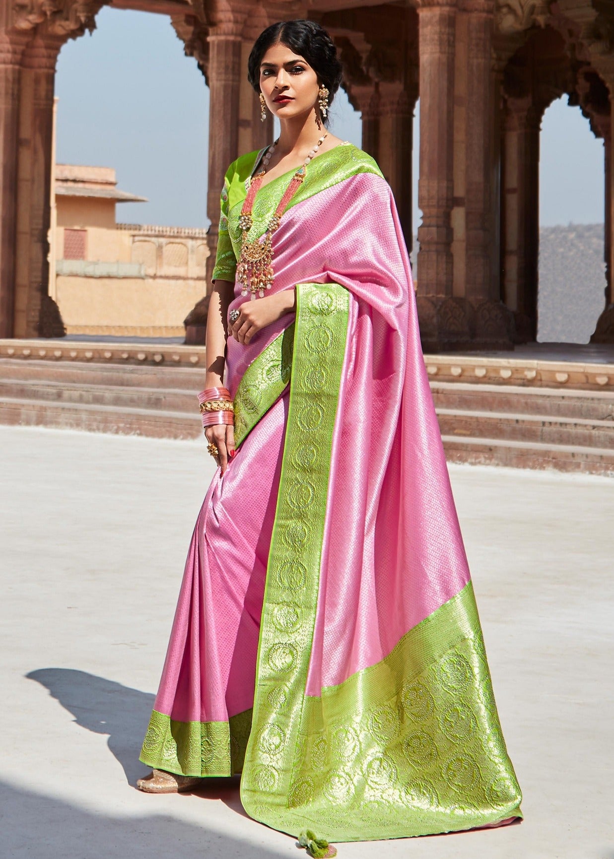 Shop kanjivaram silk pink saree online in usa with green embroidered blouse.