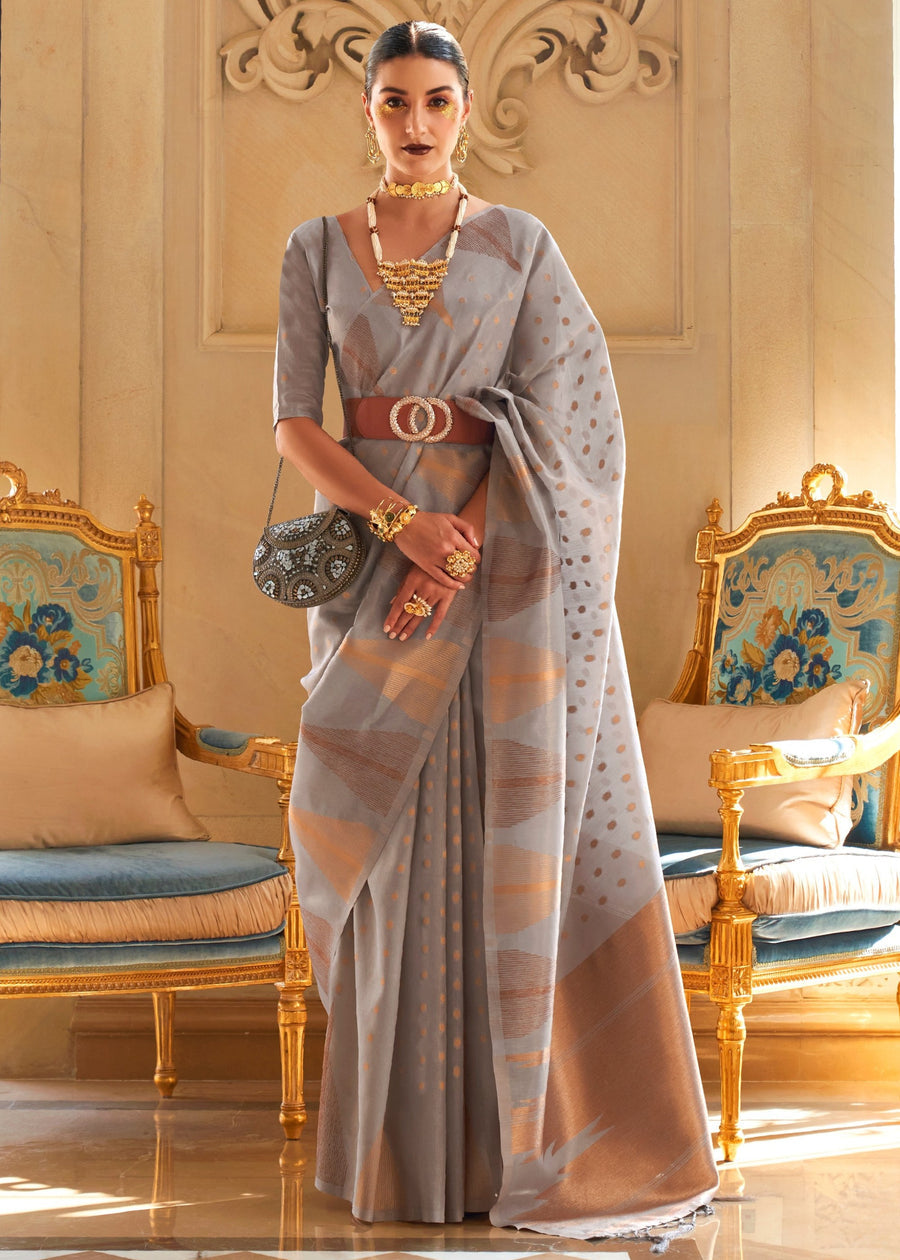 Kanjivaram tissue silk grey saree with traditional zari weaving and matching blouse piece for wedding and festive wear.