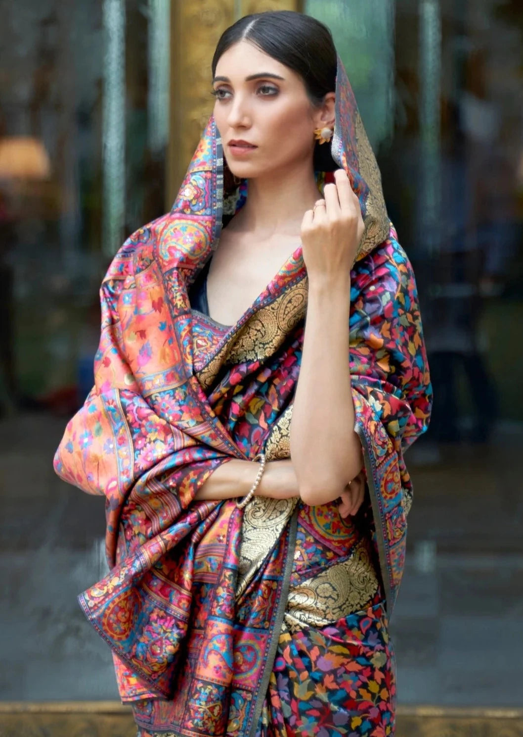 Woman in ghoonghat wearing Black kashmiri silk saree online.