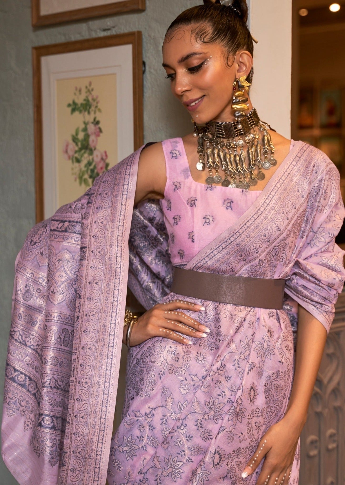 Woman in pink kashmiri saree smiling
