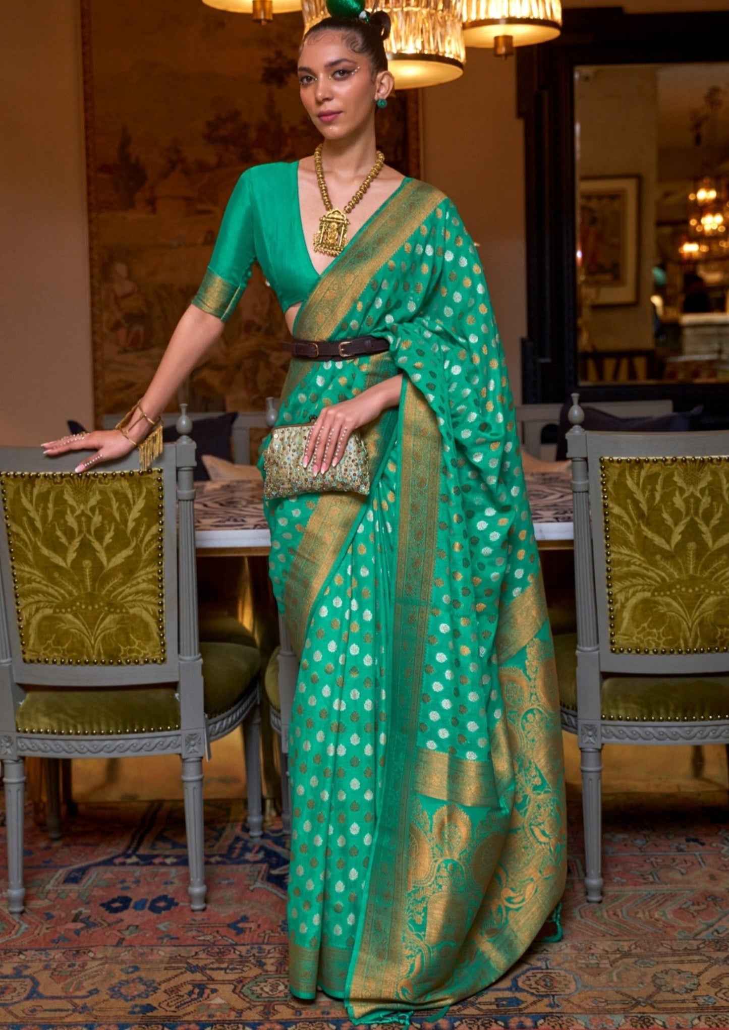 Woman in khaddi georgette banarasi saree in green color bridal design .