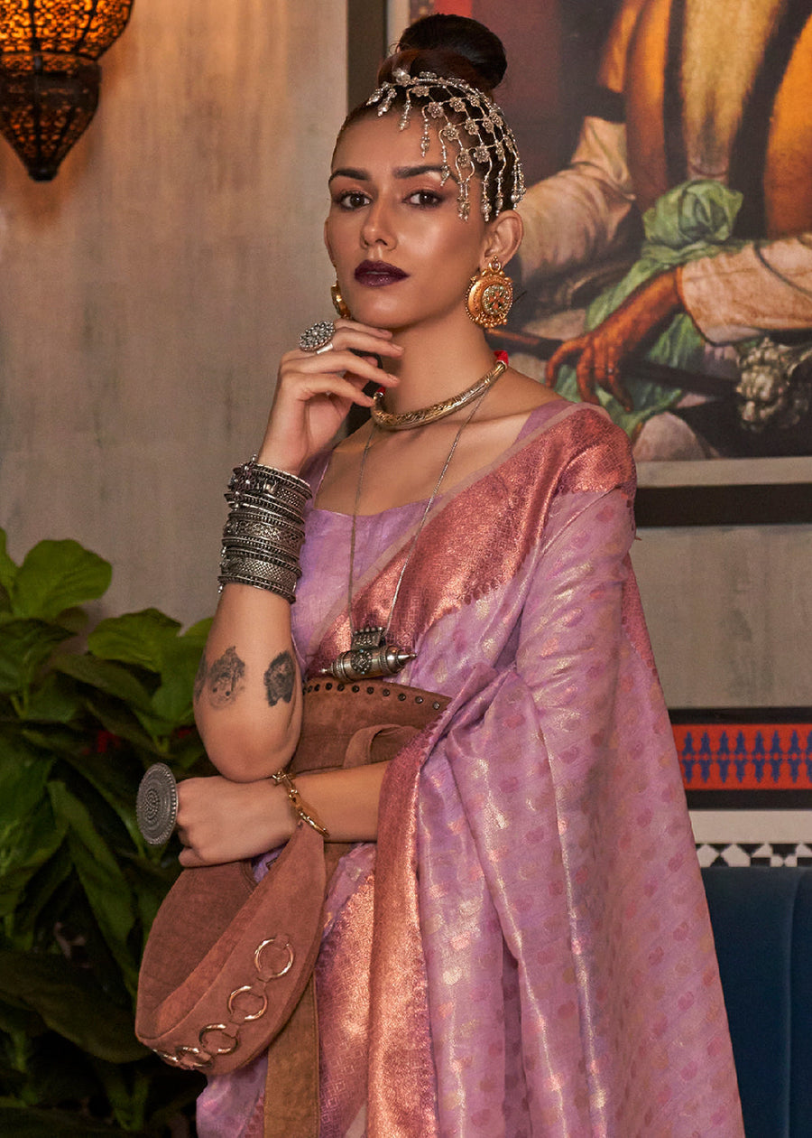 Close up of banarasi tissue silk weave saree in lilac purple on a bride draped beautifully with a matching blouse, featuring copper zari work designs.