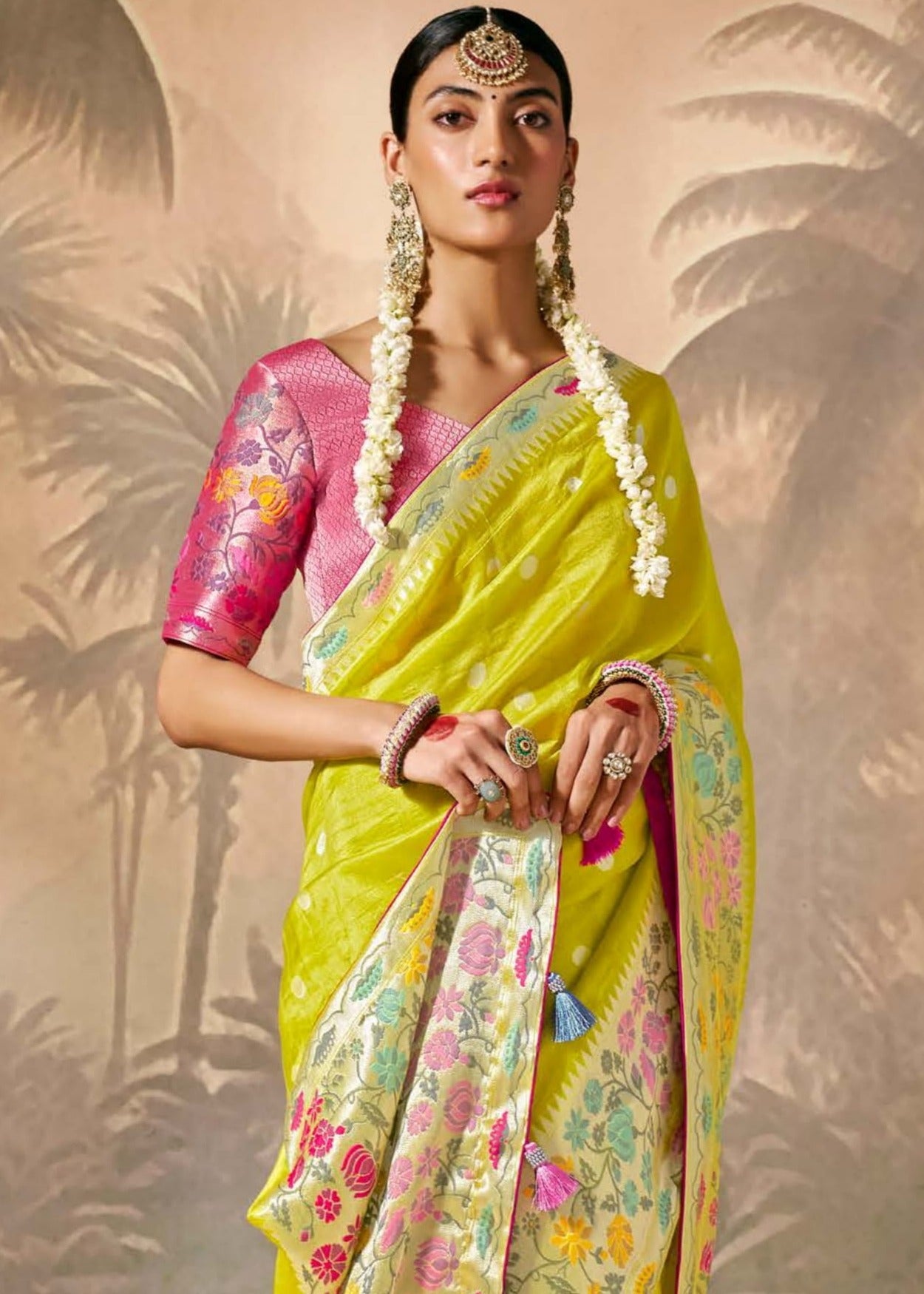 Lime yellow handloom banarasi silk luxury saree online with contrast pink blouse for bridal wear.