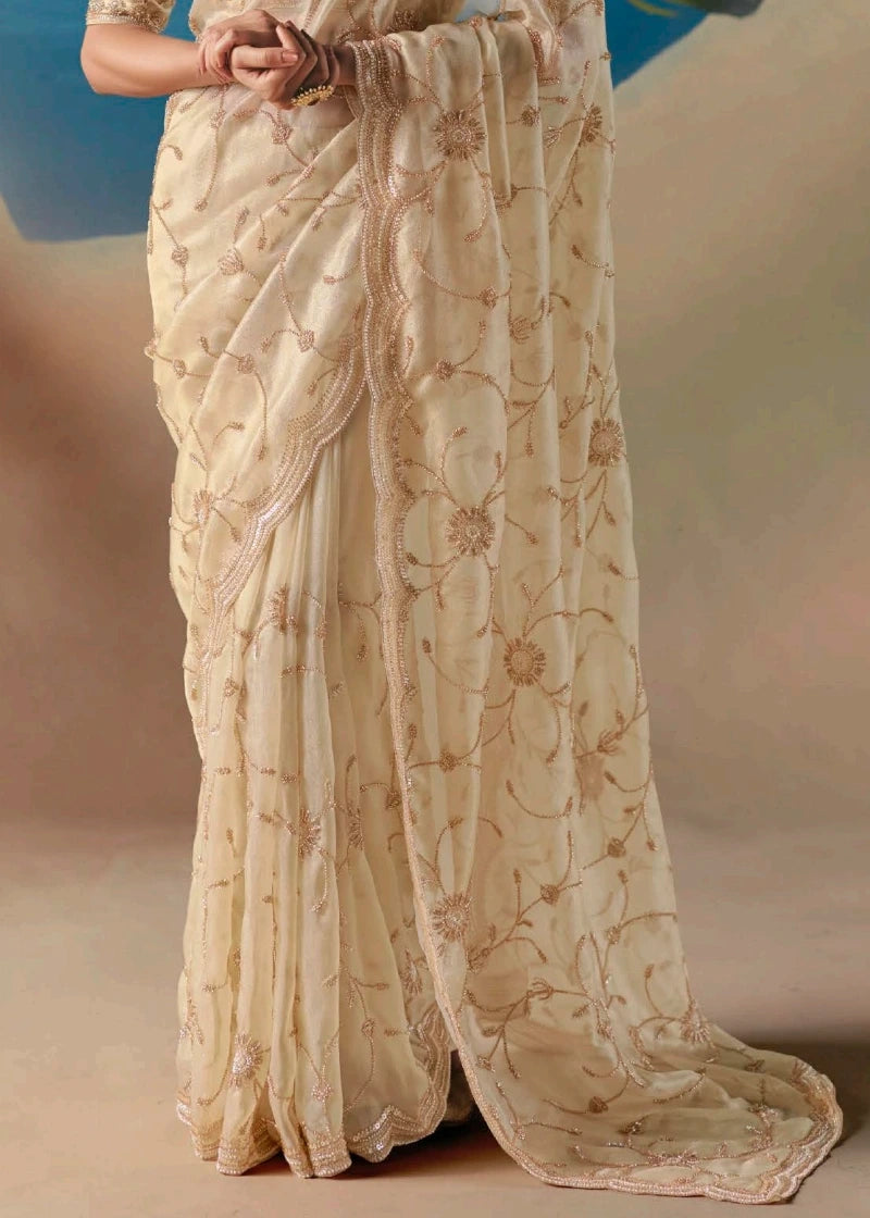 Luxury cream bridal trousseau floral saree in pure organza tissue silk fabric with hand embroidered bead and sequins detail.