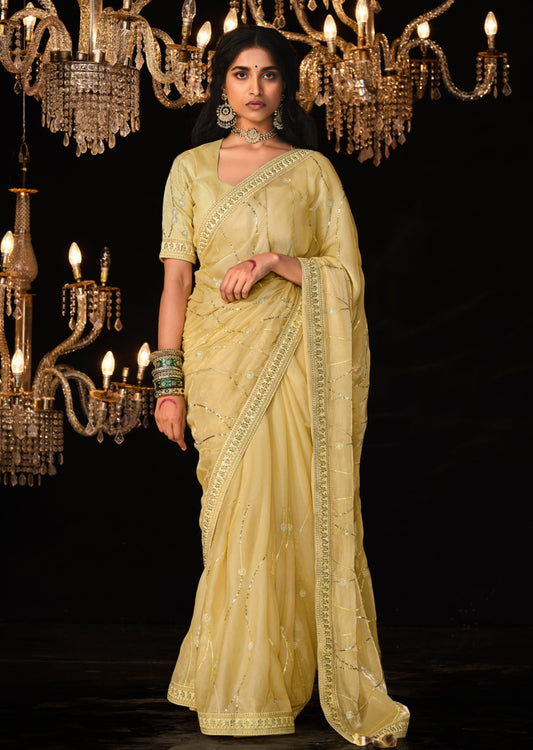 Luxury organza saree with banarasi blouse online in yellow color with handwork embroidery designs.