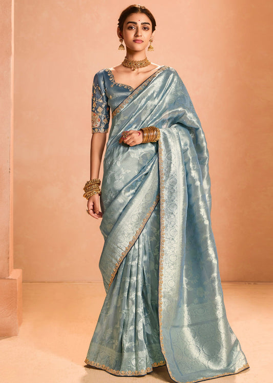 Luxury pure banarasi tissue silk embroidered pastel blue handloom saree with intricate designs for wedding wear.