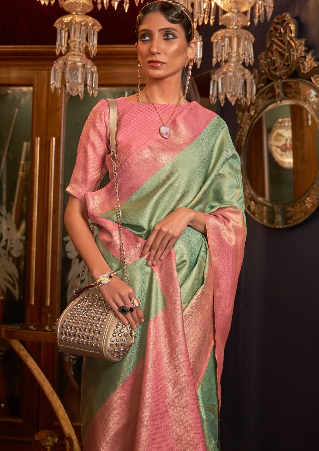woman in mint green saree with contrast pink border & blouse