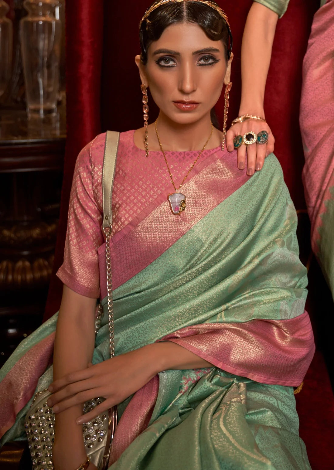 bride in mint green saree with contrast pink blouse