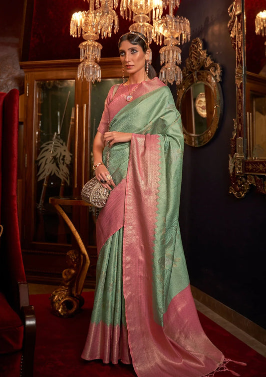 bride in mint green saree with contrast pink border & blouse