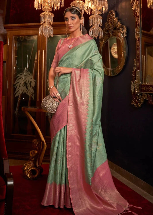 Bride in mint green saree with contrast pink border & blouse.