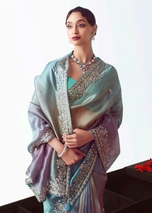 multicolor blue organza tissue silk embroidered saree with blue banarasi blouse made in luxury organza tissue silk featuring heavy embroidery designs.
