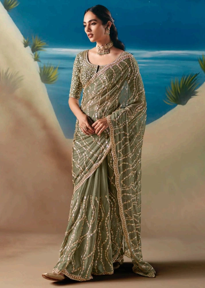 Olive green designer organza tissue silk saree with hand embroidery beadwork and sequins perfect for wedding guest and bridesmaid.