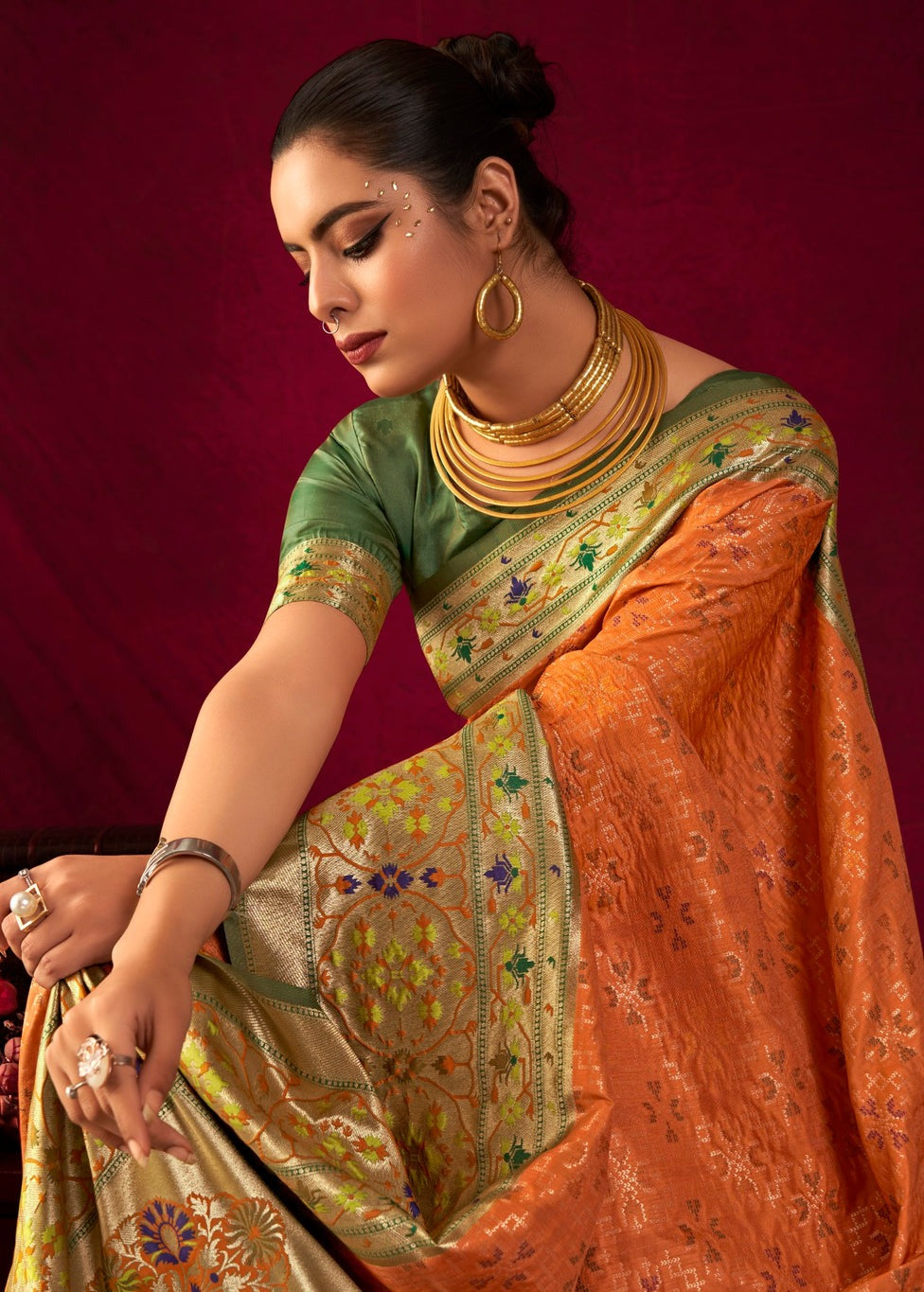 Orange paithani patola handloom banarasi silk saree online shopping with contrast green blouse.