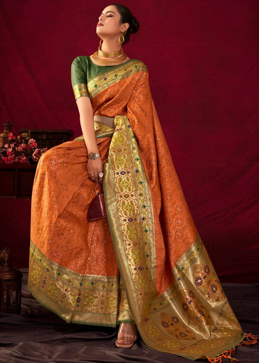 Buy orange handloom paithani patola fusion banarasi silk saree online with contrast green blouse.