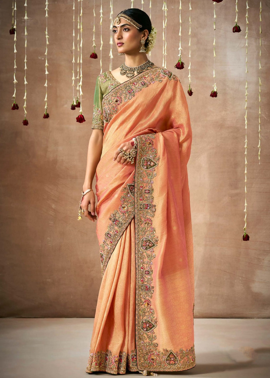 Handloom banarasi tissue silk hand embroidery work orange saree online with contrast green blouse.