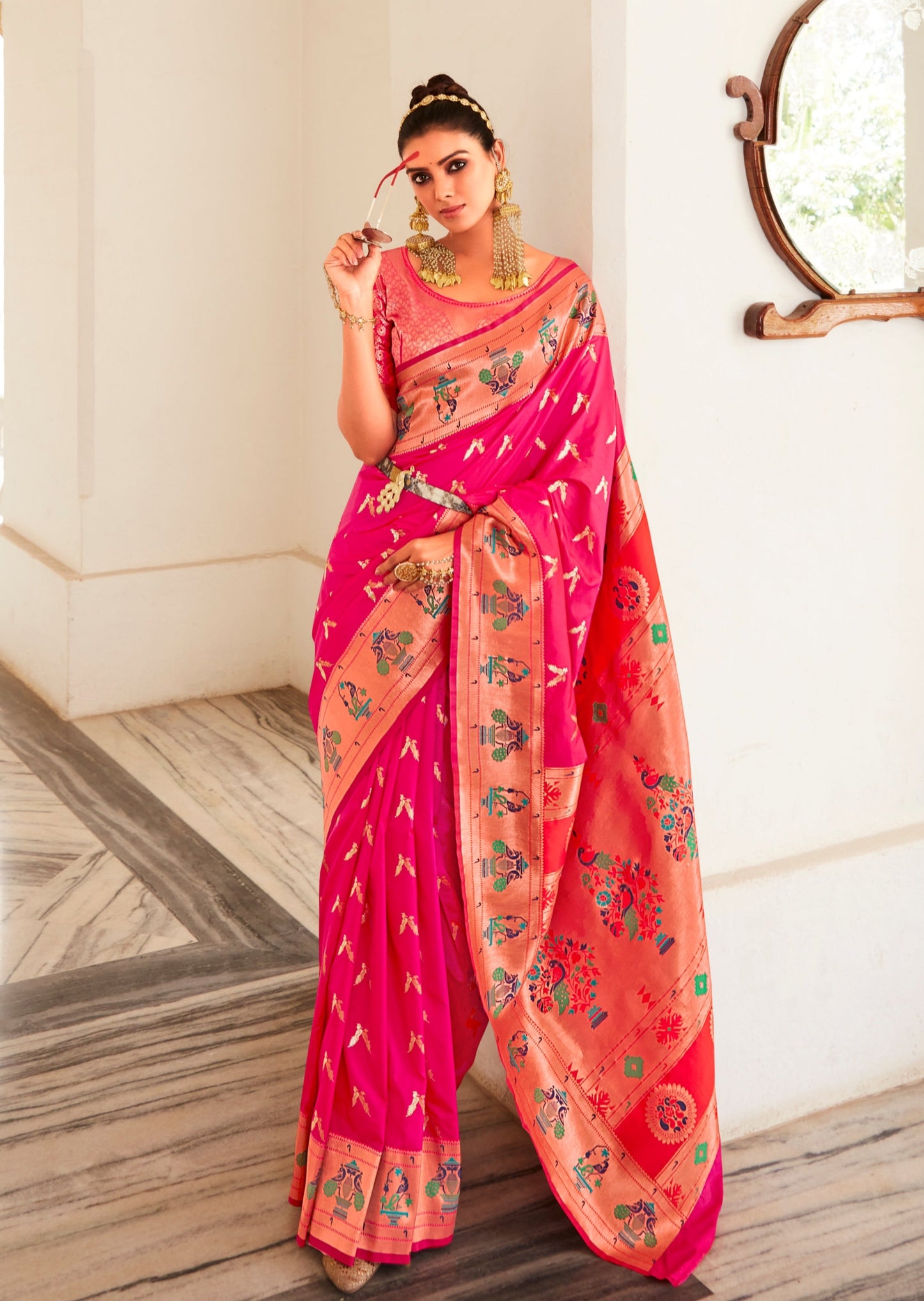Woman in pink colour Paithani Silk Saree blouse