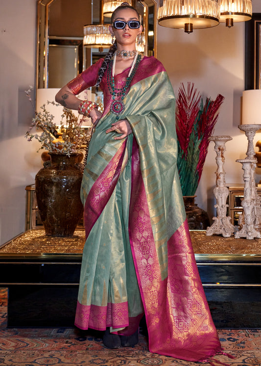 Shop pastel blue banarasi tissue silk handloom saree online in india and usa with contrast magenta pink blouse.