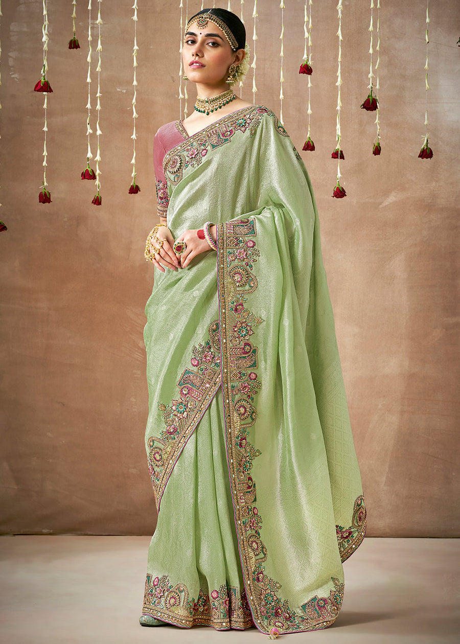 Shop pastel green banarasi tissue silk handloom saree online in india and usa with contrast pink blouse.