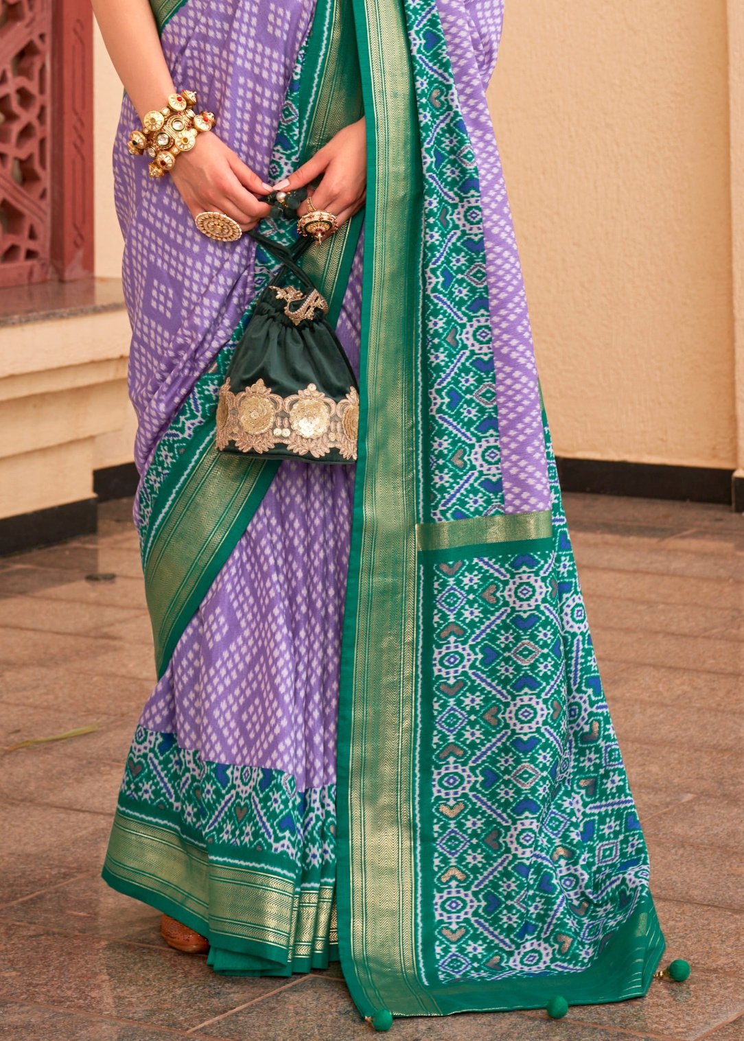 Pastel purple patola silk saree with green blouse online price.