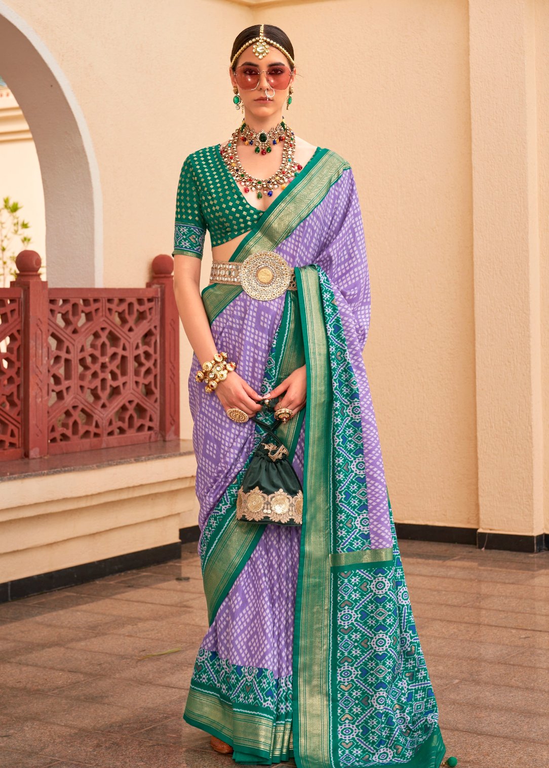 Pastel purple patola silk saree with green blouse online shopping india.