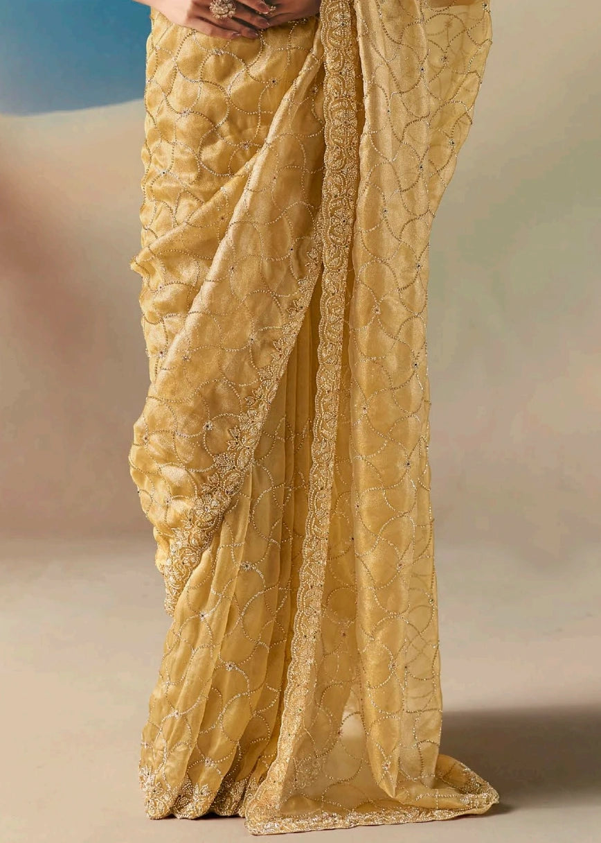 Pastel yellow designer organza tissue silk saree with hand embroidered beadwork and sequins for modern indian bridal wear and haldi ceremony.