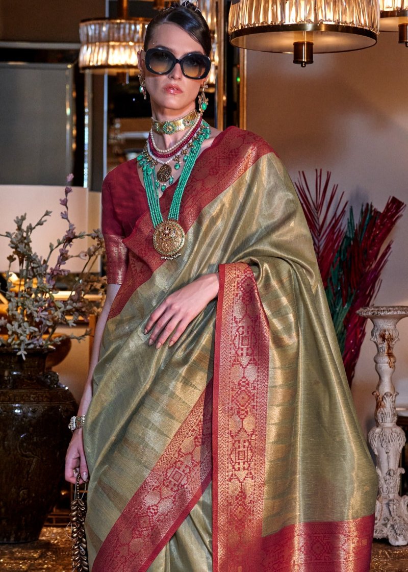 Pure banarasi tissue silk pastel green handloom saree online shopping for festive wear and wedding wear with contrast red blouse.