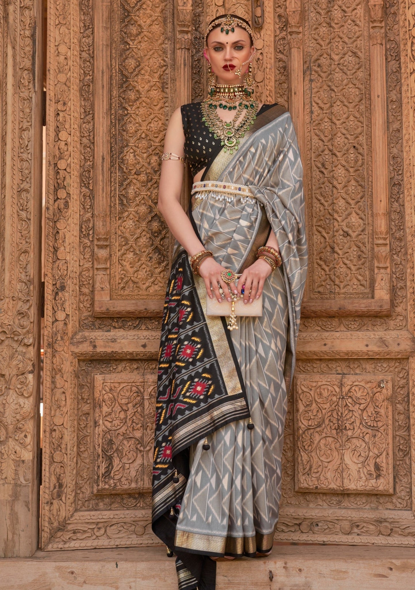 woman in grey patola saree