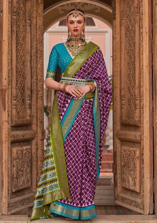 woman in purple colour double ikkat patola saree